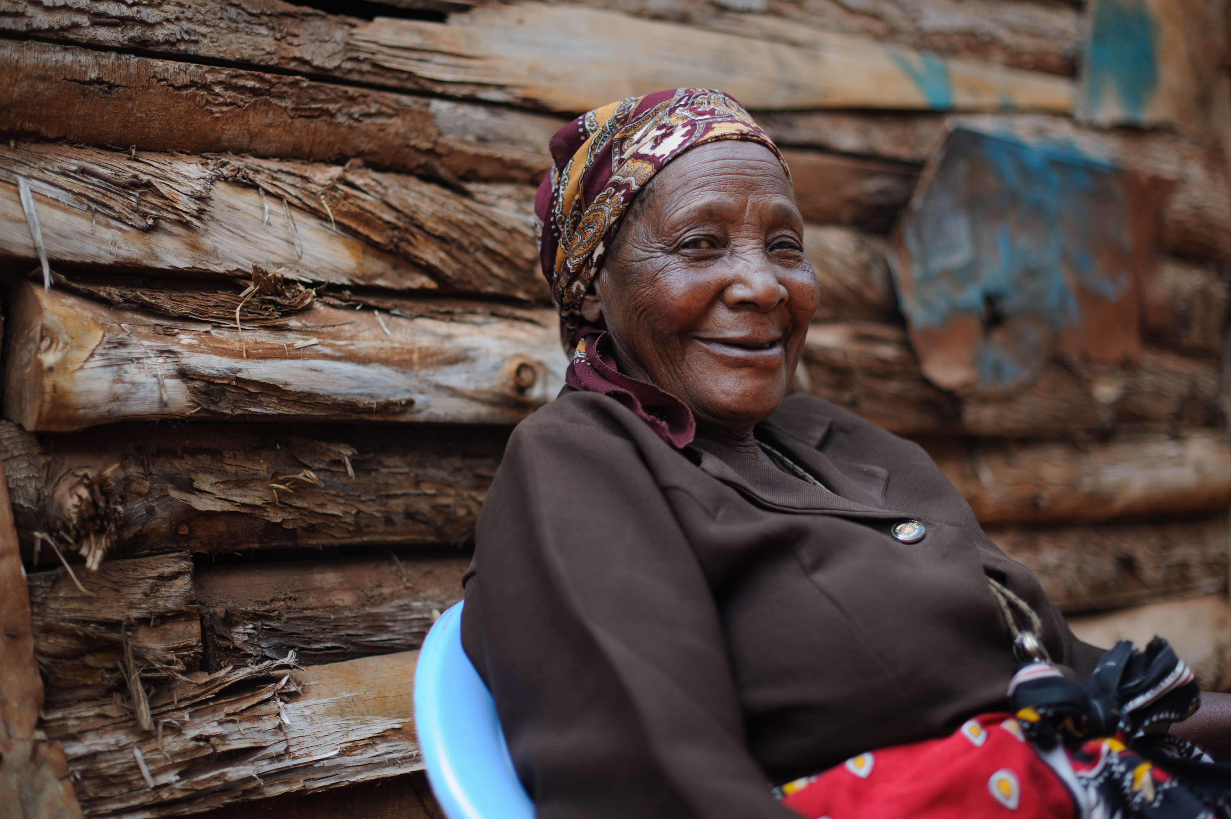 Veronica, 68, from Kenya smiles at the camera.
