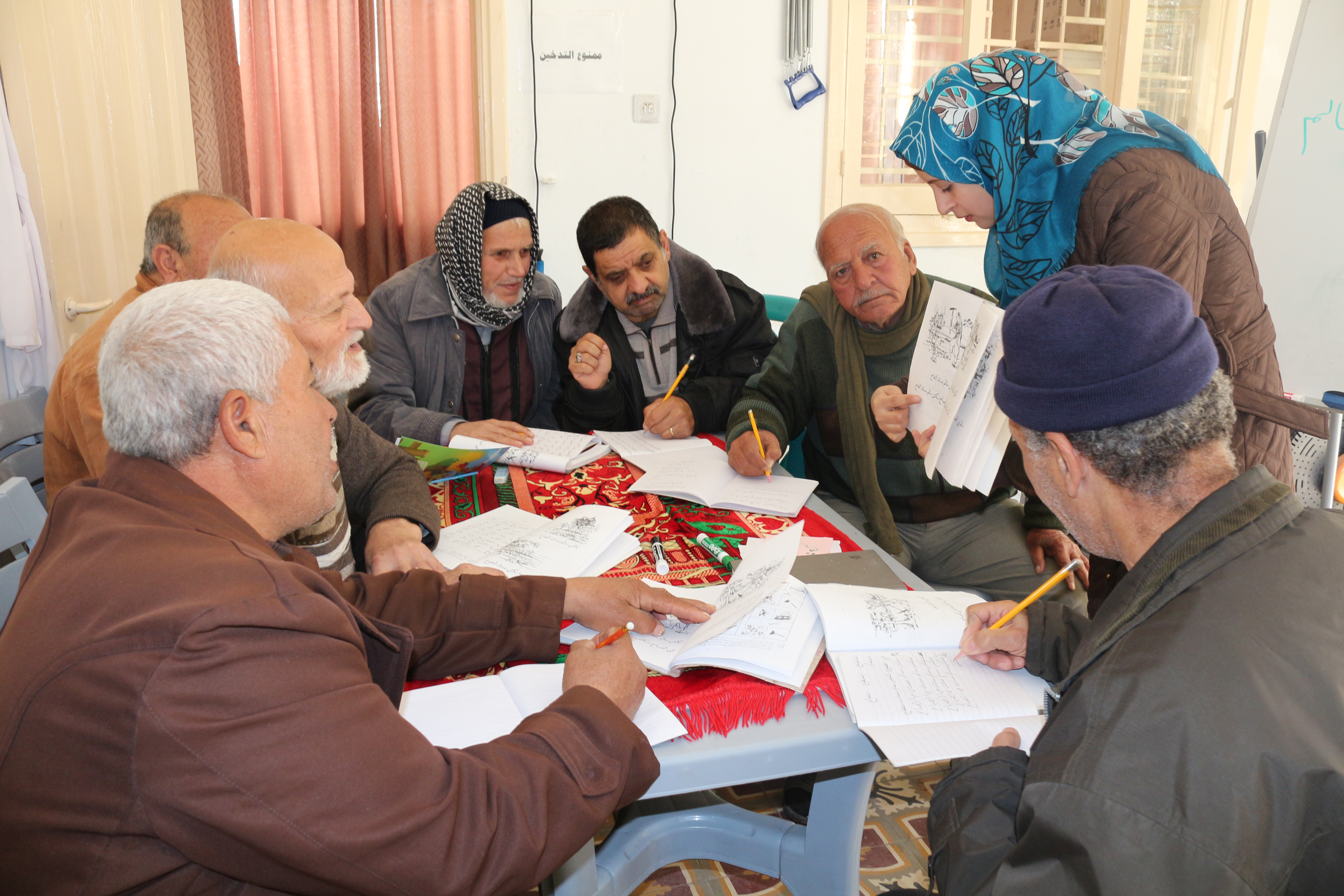 Literacy sessions at Age International's Gaza age friendly centre.