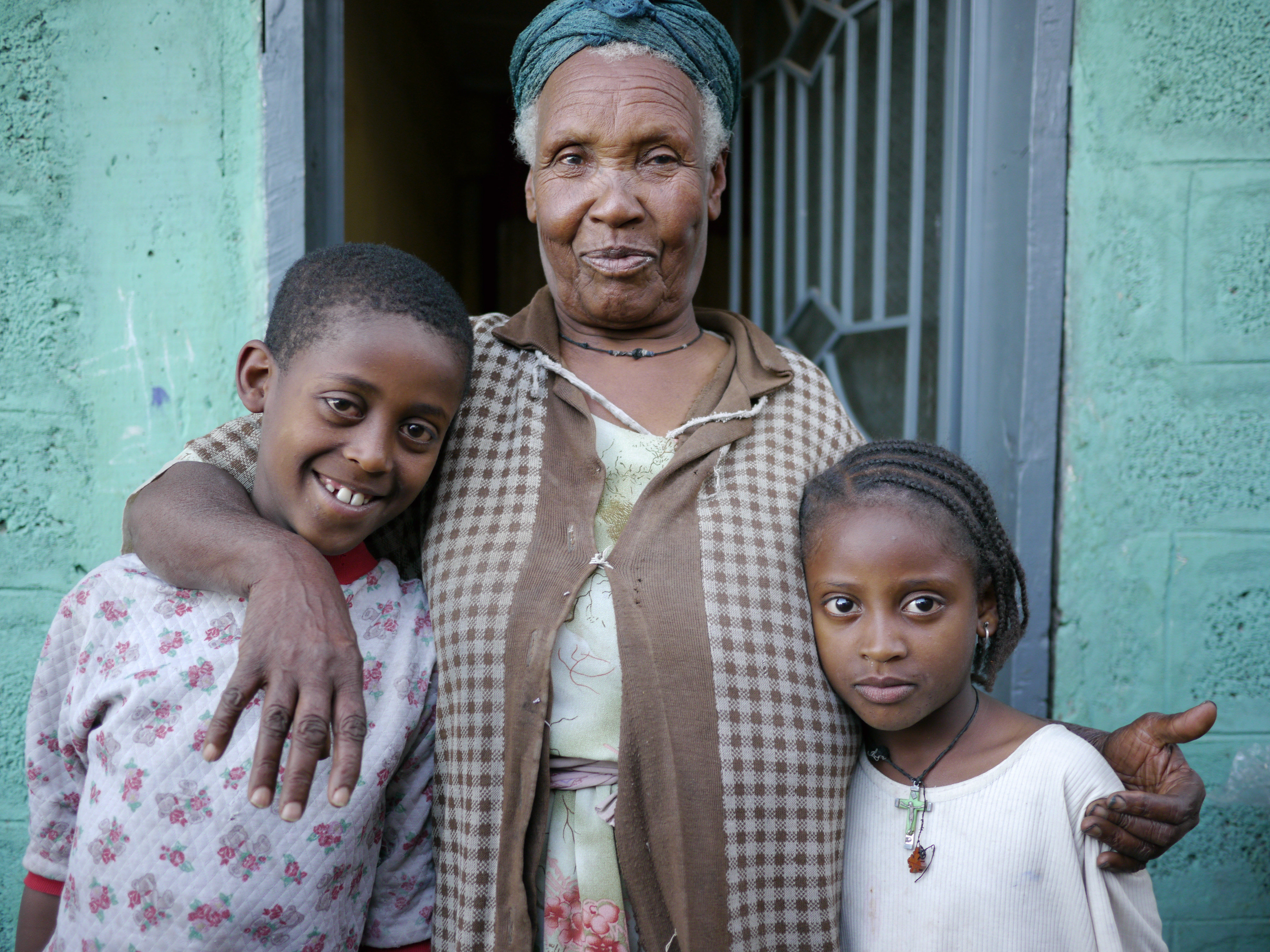 Older woman in Ethiopia and two of her grandchildren.