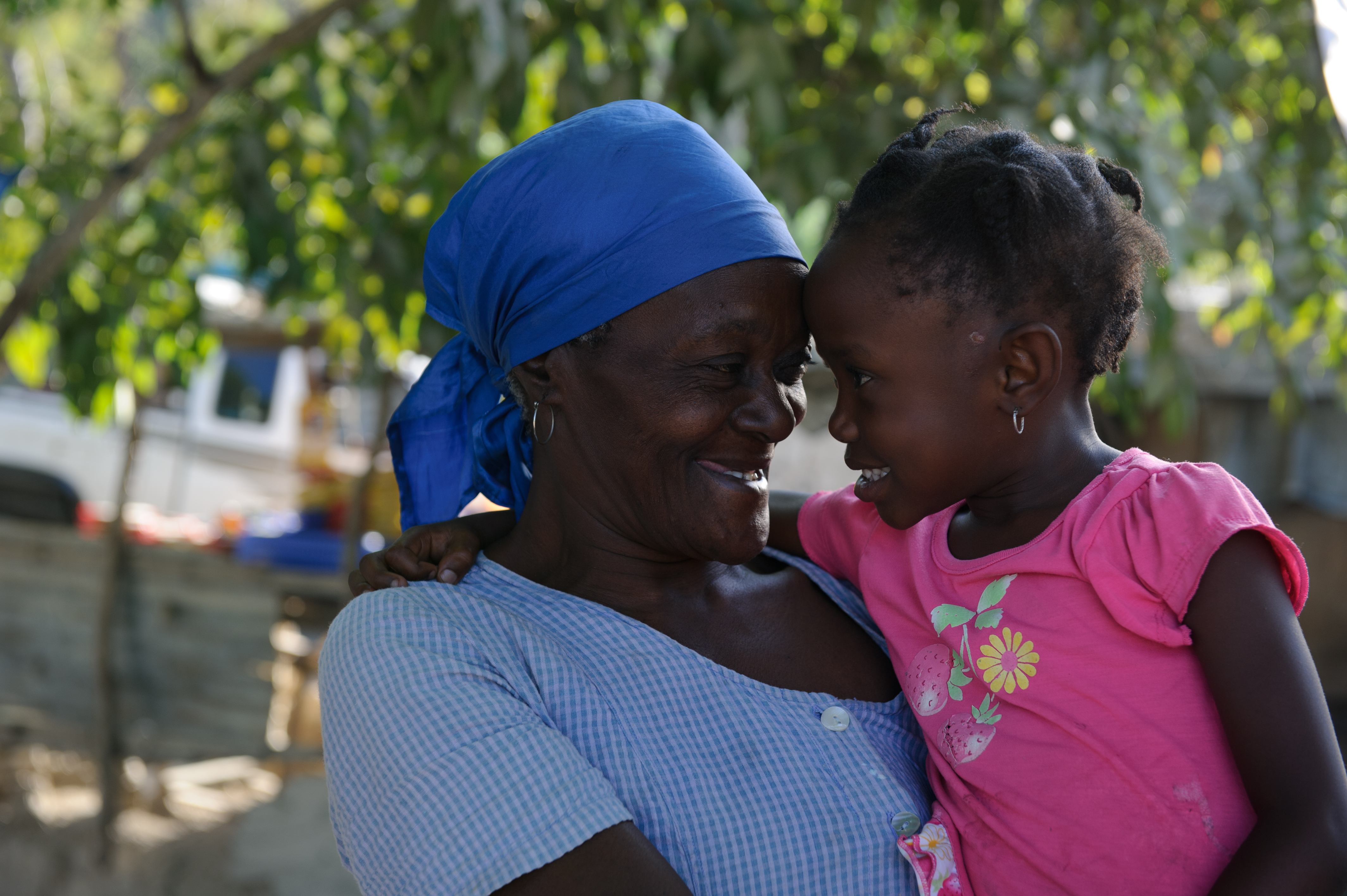 An older woman from Haiti with a child.